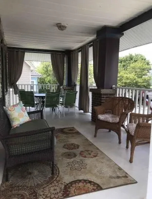 2nd floor porch with sun blocking curtains