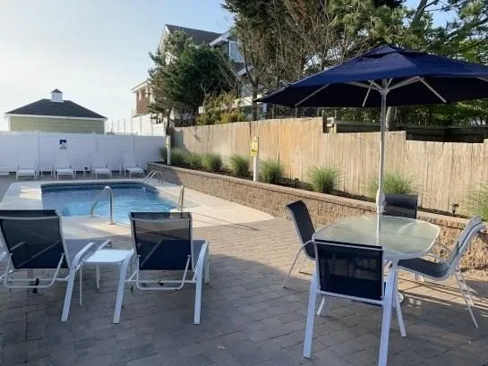 Beautiful heated pool with garden lighting