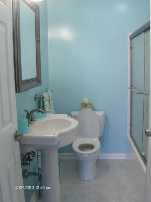 Bathroom 1 has a tub with shower.