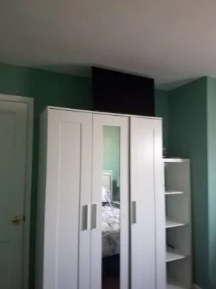 bedroom #1 with TV and window A/C